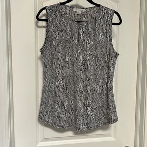 Dressy tank top with hook and eye closure in front. size L.
